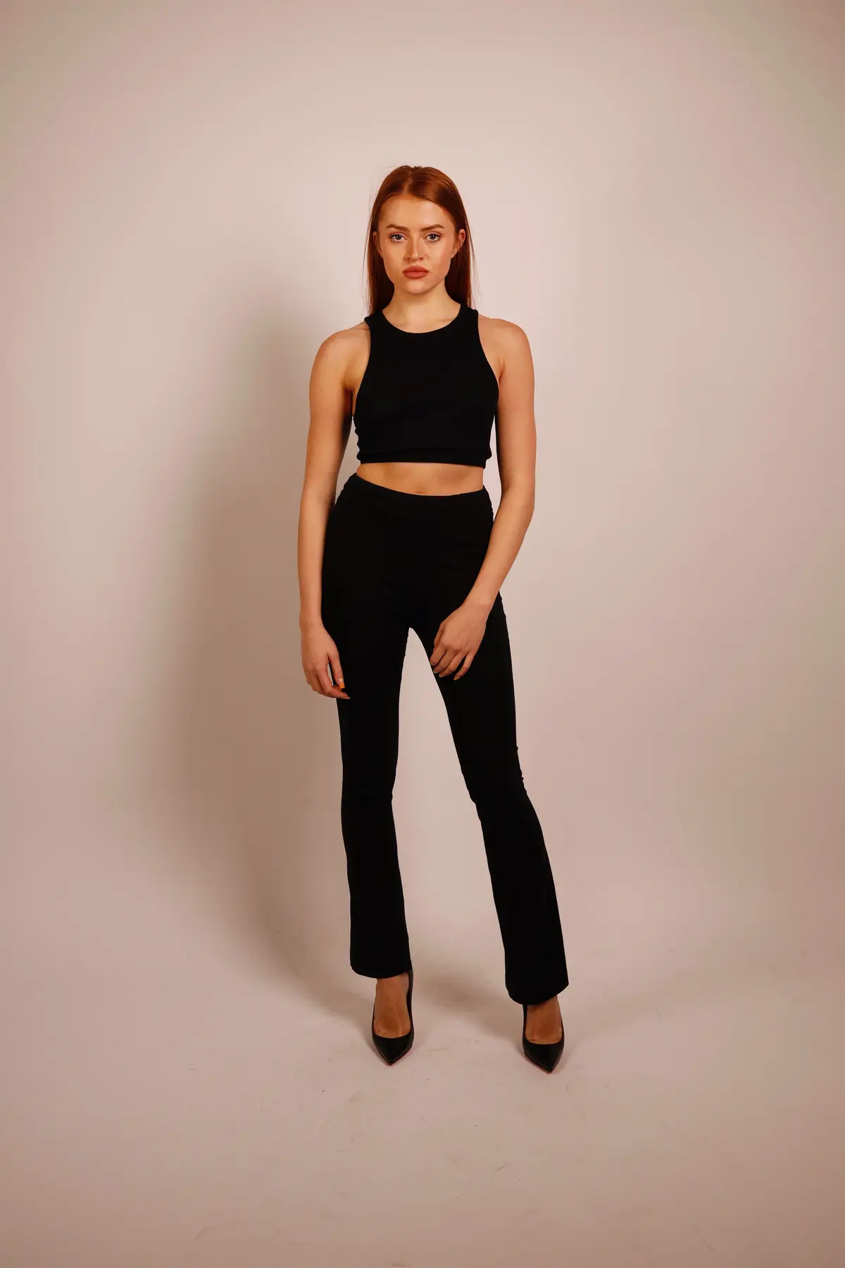 Olga Rossa full-length studio portrait, black ensemble